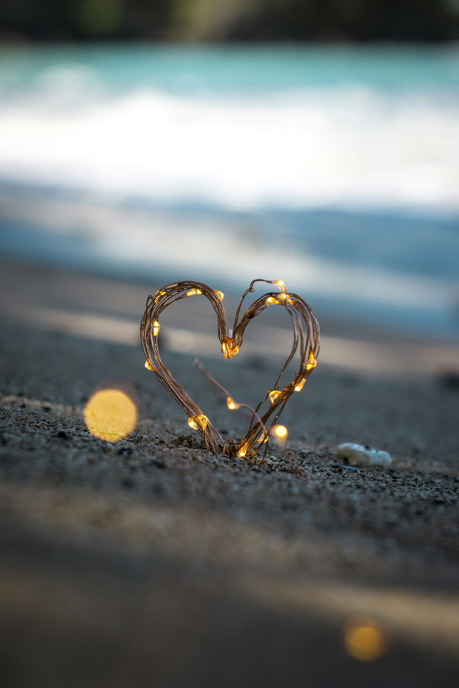 Romantic engagement party setup at a Dubai beach club with sunset views and rose petal arrangements
