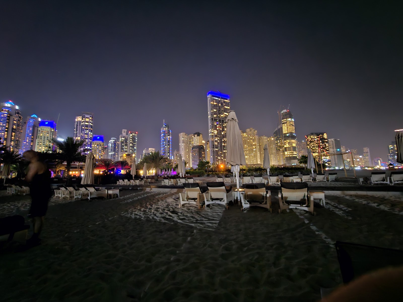 Empty beach lounge chair during sunny summer day in Dubai