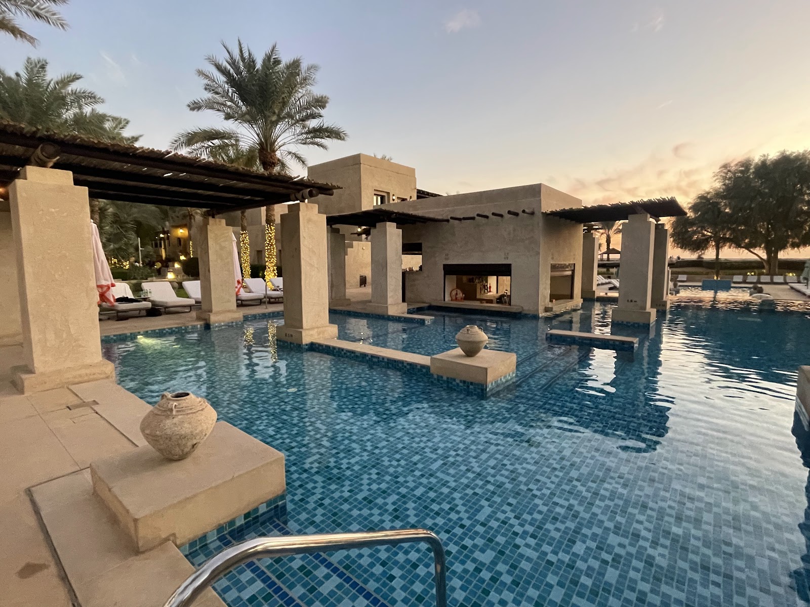 Dubai beach club pool party on Friday afternoon with DJs sun loungers and cocktails