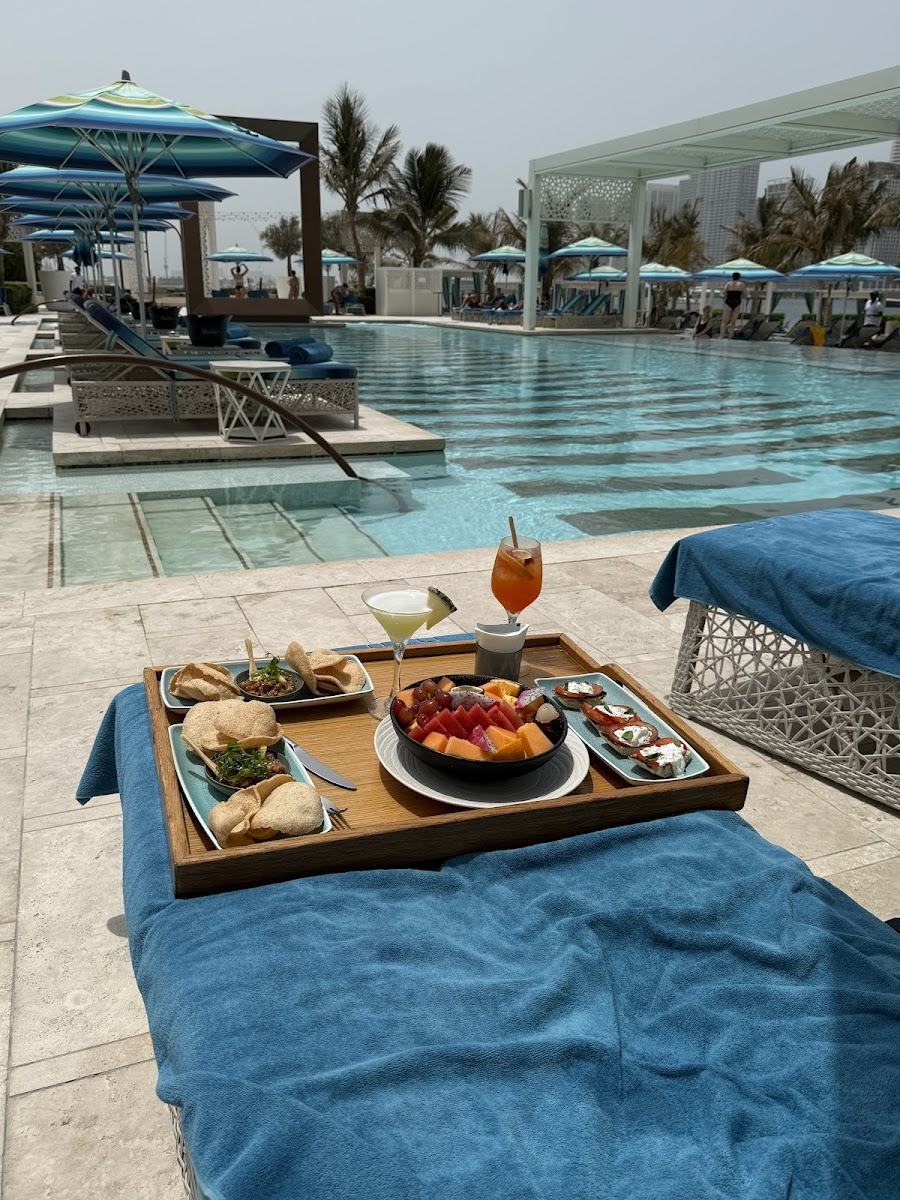 Cloud 22 rooftop pool Atlantis The Royal with private daybeds and Palm Jumeirah views