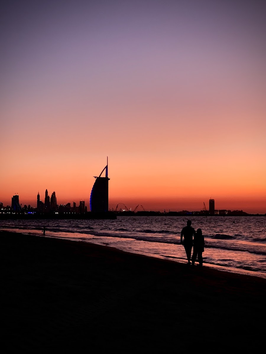 Kite Beach Dubai — iconic view of the Burj Al Arab hotel from the sandy shore of Umm Suqeim beach with turquoise water