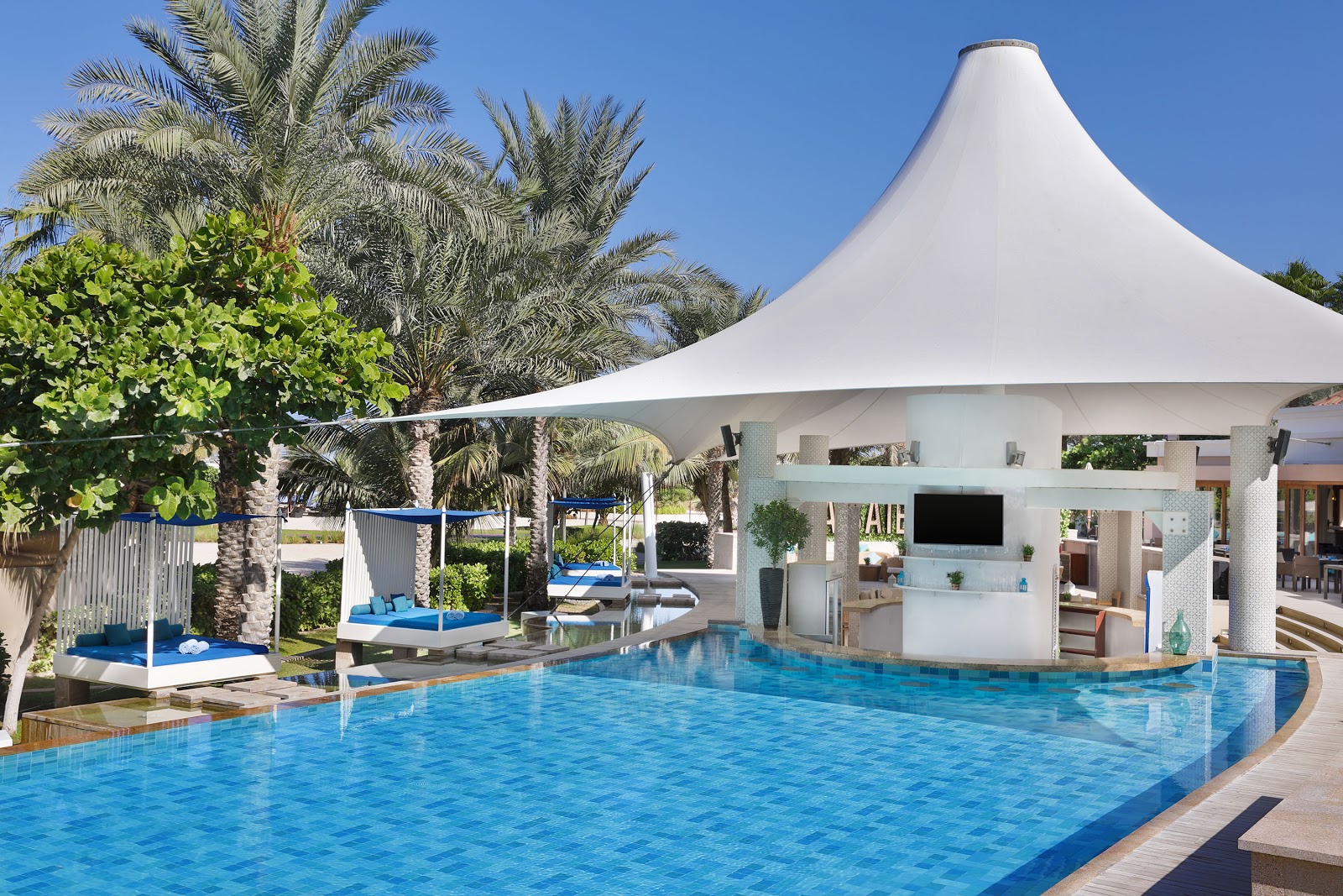 La Baie at Ritz-Carlton JBR Dubai — refined chandelier-lit lounge bar with terrace overlooking Arabian Gulf