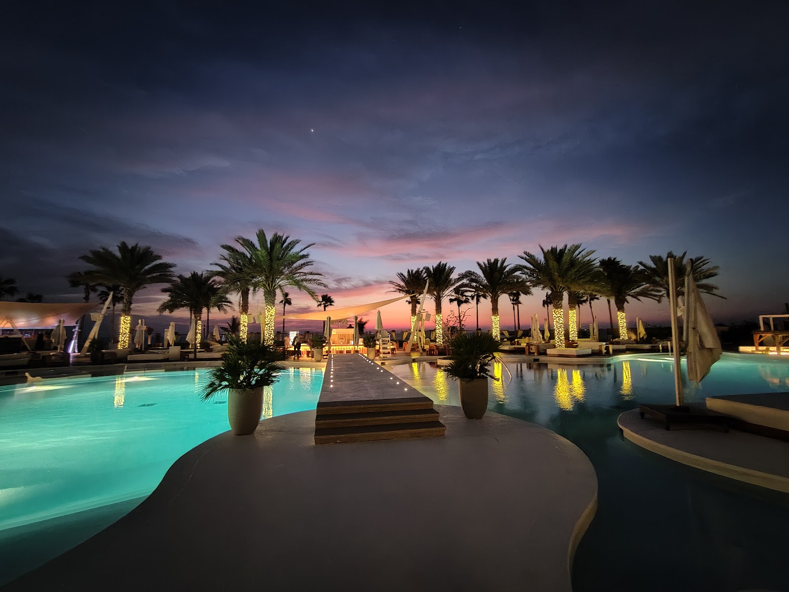 Ladies day at Dubai beach club — women at pool with cocktails