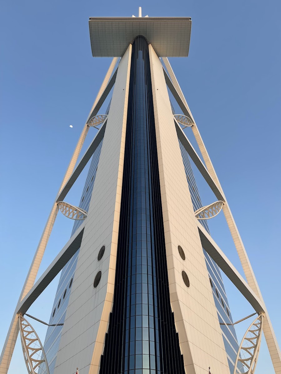 Dubai beach club pool area with sunbeds and palm trees — partner with BeachClubDXB
