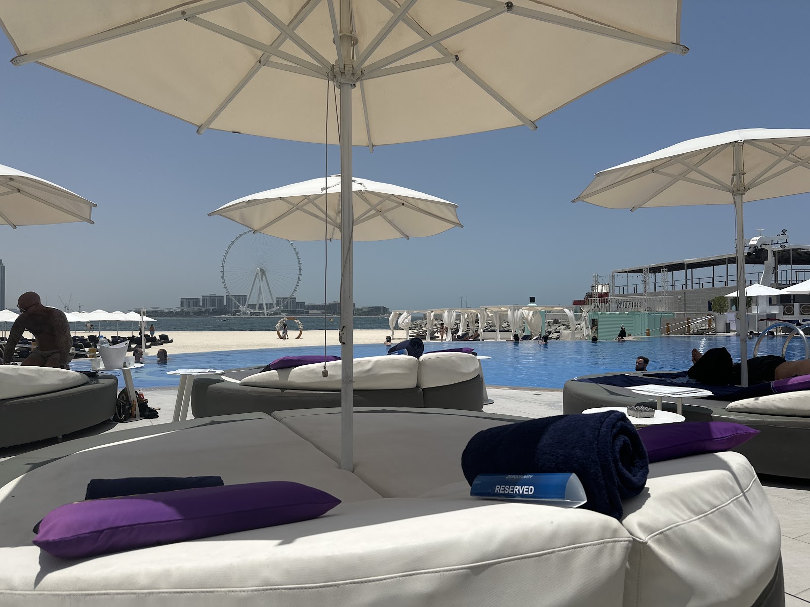 Private beach cabana with white drapes and ocean view